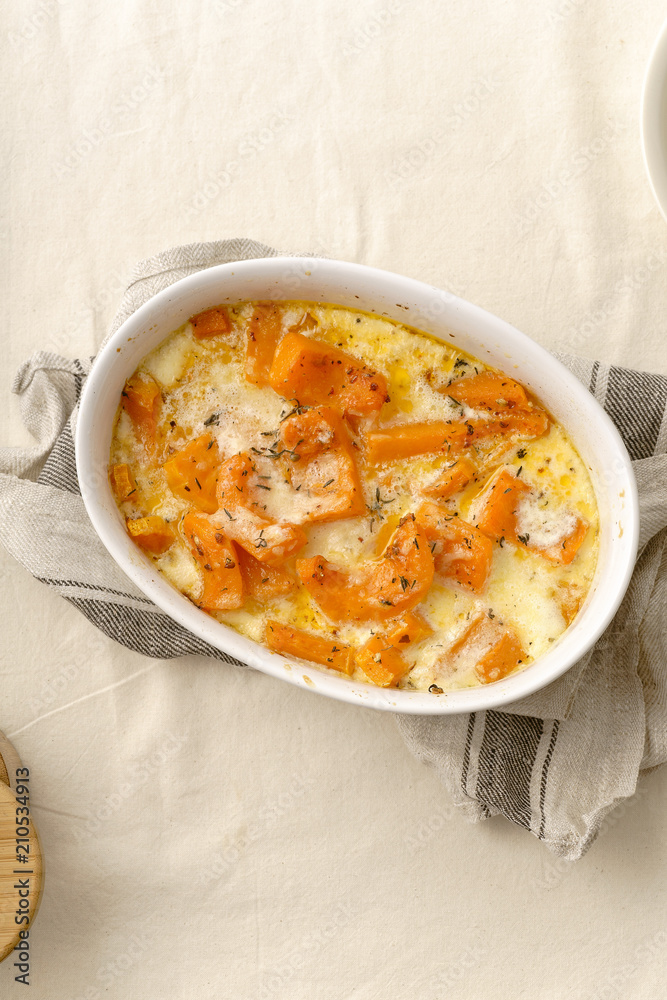 Roasted squash baked with heavy cream, thyme, white wine and parmesan cheese Roasted squash baked with heavy cream, thyme, white wine and parmesan cheese