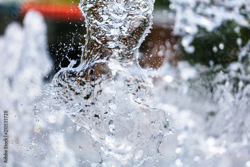 Tableau sur toile Splashing water with drops as an abstract background