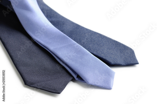 Different men's neckties in blue tones isolated on white background