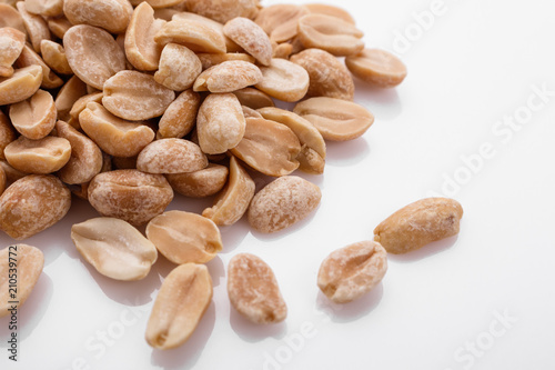 fresh peanuts on a white acrylic background