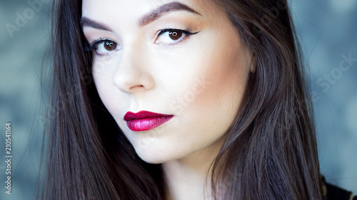 Young beautiful brunette woman portrait close-up, bright makeup