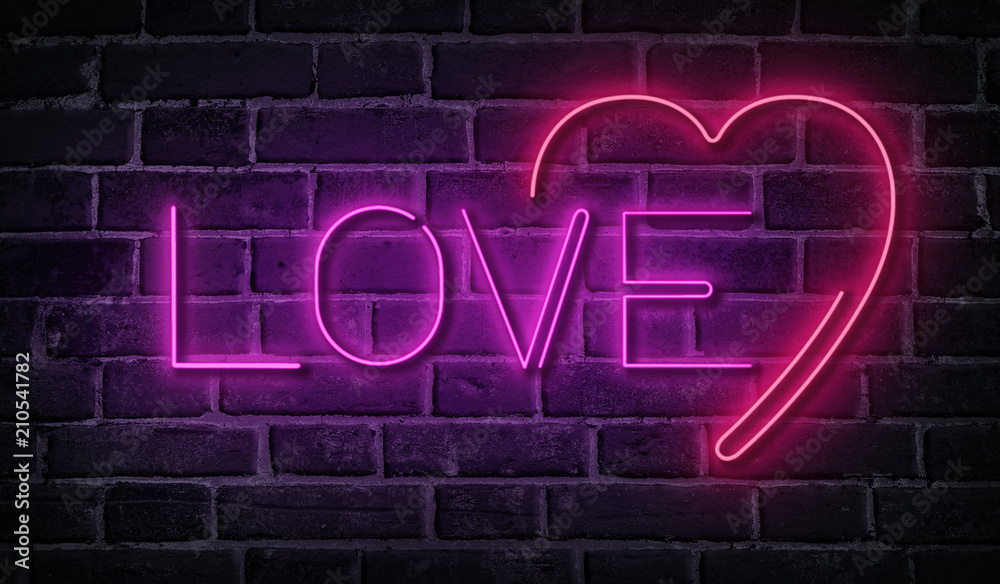 Love neon word on brick wall. Pink glowing signboard.