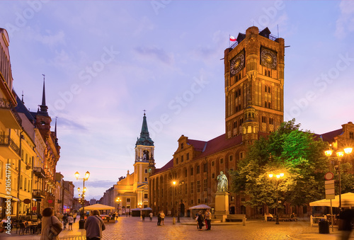 Torun Town Hall and monument of Copernicus at night