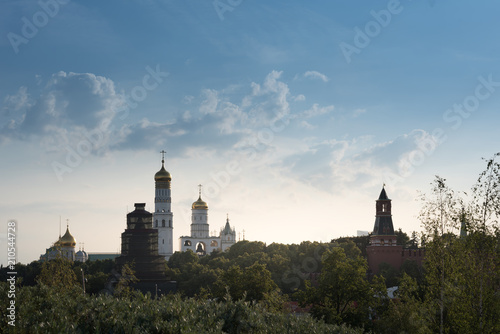 Beautiful panorama day view of Moscow Kremlin with Saint Basil's Cathedral over the console bridge of the park Zaryadie