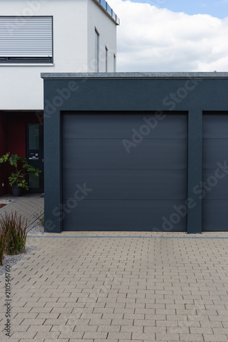 modern black garage in suburban street