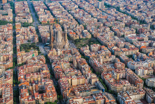Aerial view of Barcelona Eixample residencial area and Sagrada familia, Spain. Late afternoon light