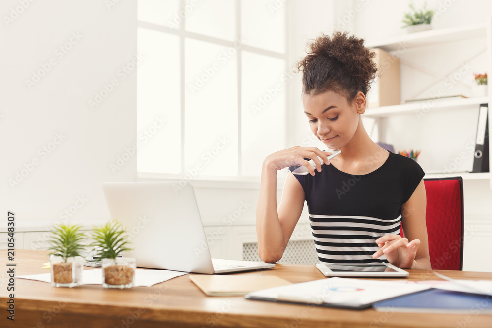 Black business woman working on digital tablet Black business woman working on digital tablet
