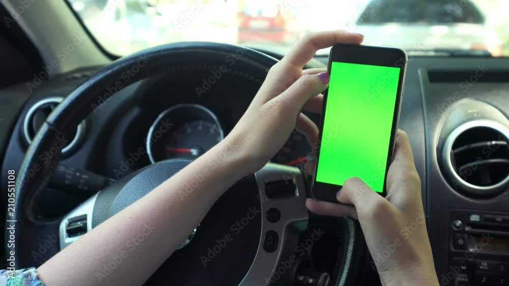 Girl Driver closeup, greenscreen in the car, urban city background greenscreen chrome key 4k. Sweeps his hand across the screen to the right Girl Driver closeup, greenscreen in the car, urban city background greenscreen chrome key 4k. Sweeps his hand across the screen to the right