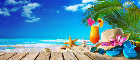Straw hat and sunglasses on beach