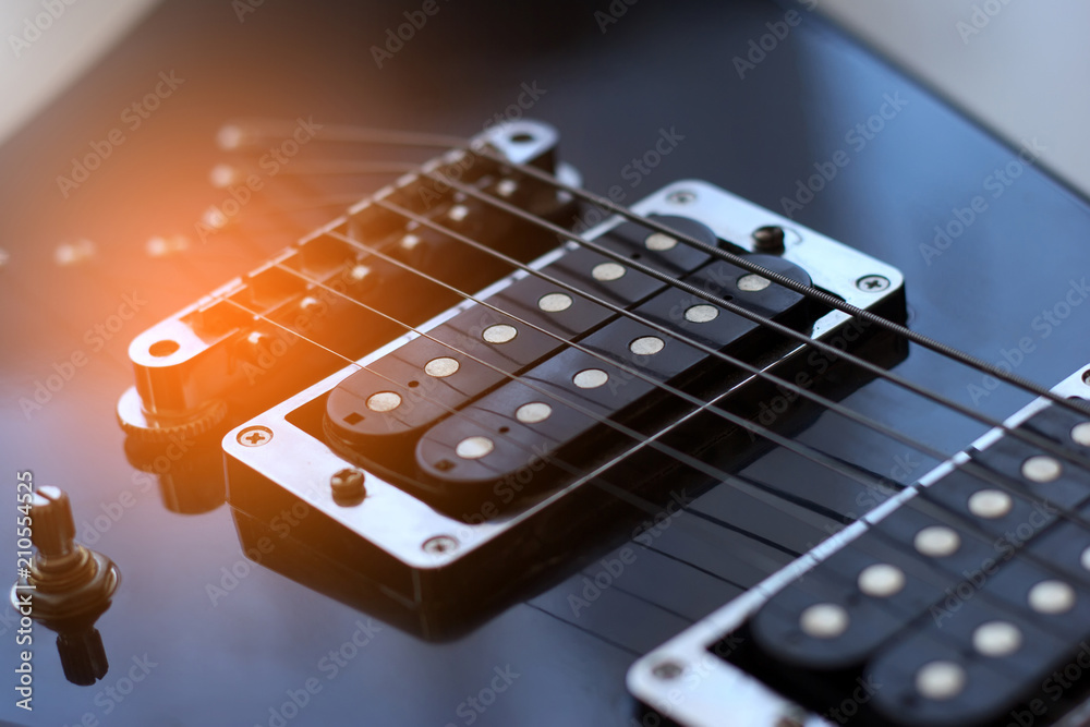 Black arrowed electric guitar close up