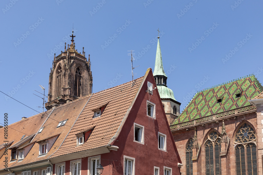 view to old half timbered houses and church Saint George in Selestat