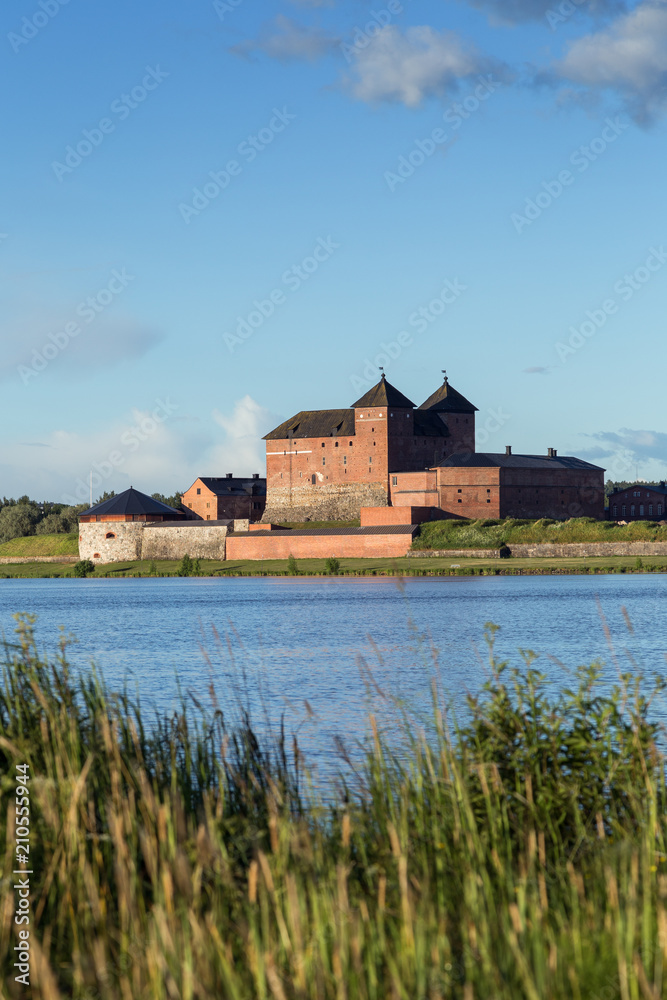 Beautiful view of the 13th century Häme Castle and lake Vanajavesi in Hämeenlinna, Finland, on a sunny day in the summer. Copy space. Beautiful view of the 13th century Häme Castle and lake Vanajavesi in Hämeenlinna, Finland, on a sunny day in the summer. Copy space.