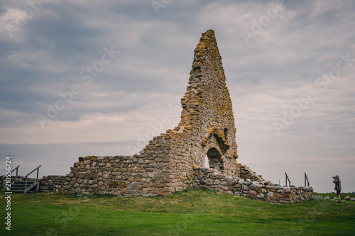 man taking photo of an old ruin