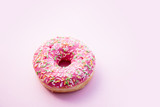 Fresh sweet donut on pink background. Abive view