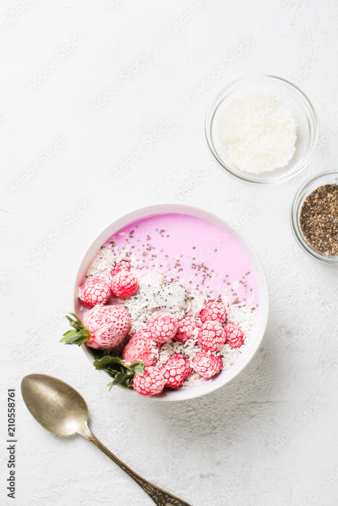 Pink smoothie in bowl with pitaya, strawberry and raspberry Pink smoothie in bowl with pitaya, strawberry and raspberry