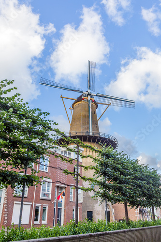 Windmill beween modern appartment buildings in the center of Dordrecht, Netherlands photo