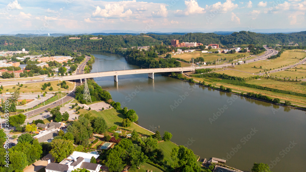 Tennessee River with a bridge and swimming pool at an expensive home