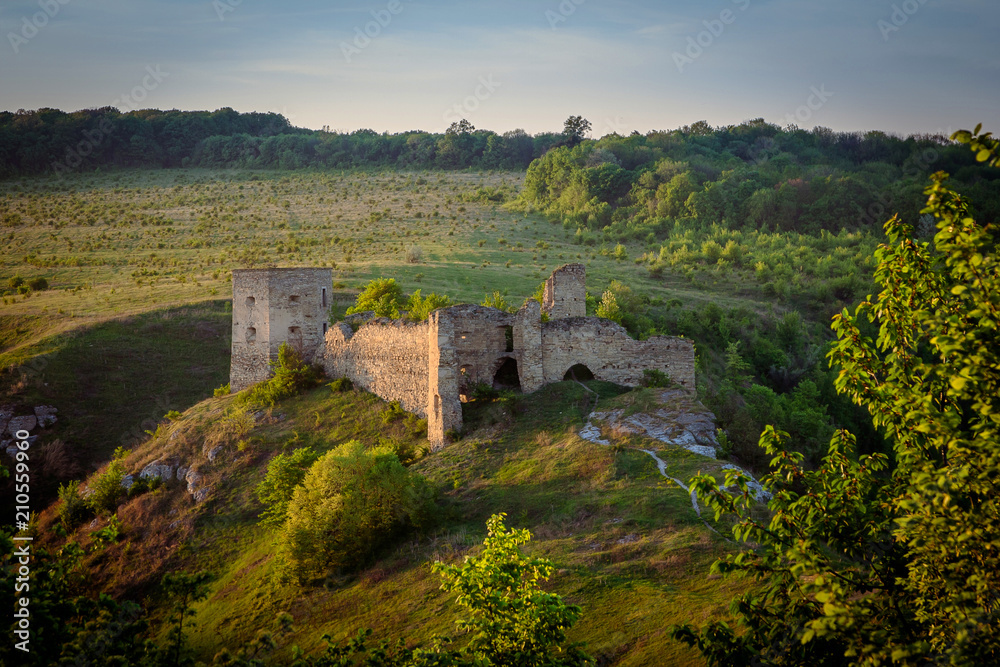 Castle ruins on the hill in Kudryntsi. Podilia region, Ukraine.