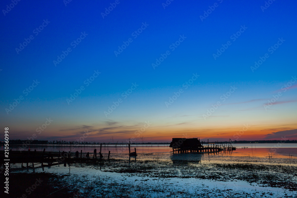 Colorful of sunset timing with sky reflect on water