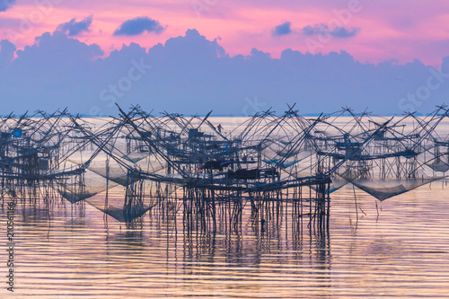 scenery sunshine above  fishing trap at Pak Pra lagoon in Talay Noi Phaphalung province Thailand. photo