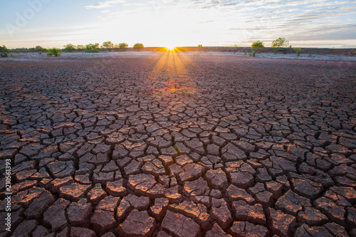 Soil crack on dry condition with sunset background
