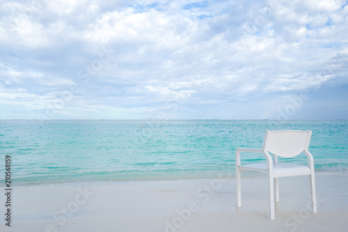 Summer concept , White chair on the beach white sand and turquoise sea color at maldives on the weekend holidays © godshutter