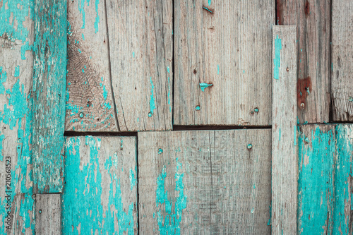 Old shabby wooden background with flaking blue paint