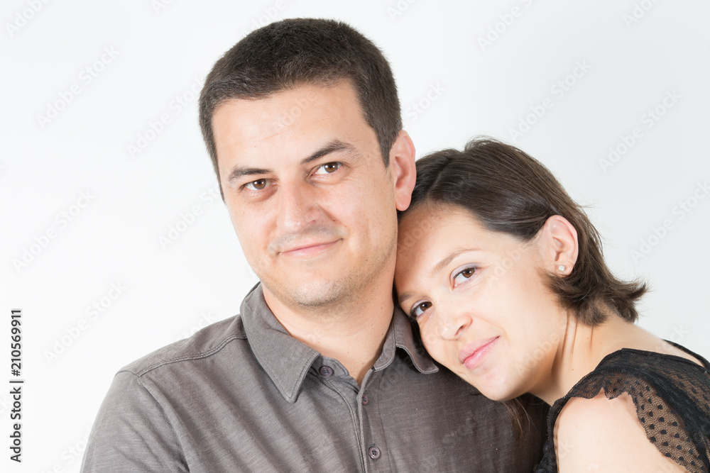casual cute couple posing in white isolated studio background in love and tenderness casual cute couple posing in white isolated studio background in love and tenderness