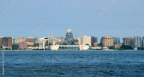 City skyline and architecture background.Cloudy blue sky over downtown with capitol state building and Monona terrace.Summer view across the lake Monona. City of Madison, the capital of Wisconsin, USA © Maryna