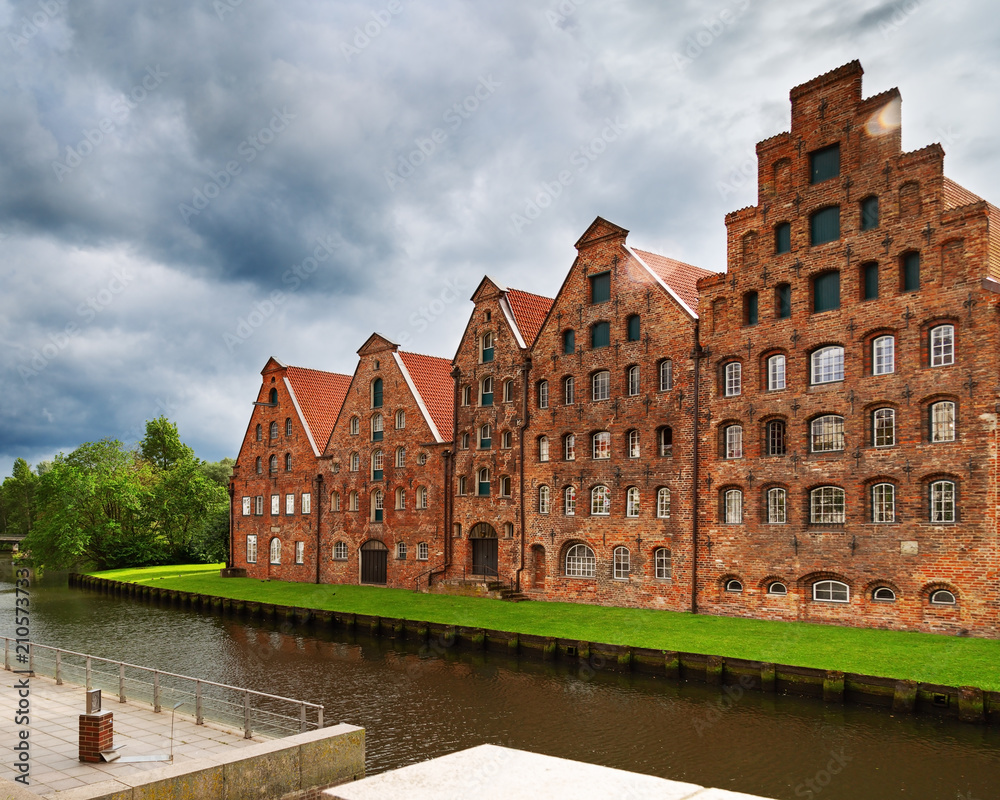 Urban landscape of city of Lubeck. Museum Holstentor in old historical building. Attraction of old town. Germany, June 2017. Urban landscape of city of Lubeck. Museum Holstentor in old historical building. Attraction of old town. Germany, June 2017.