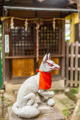 A stone fox in a Shintoist shrine in Tokyo