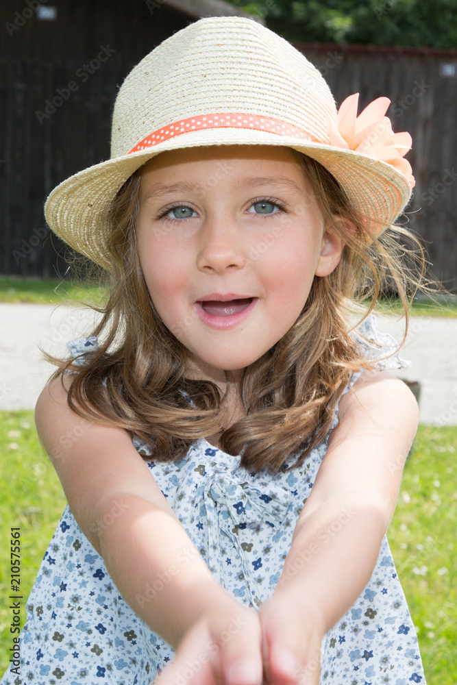 Outdoor Portrait of a Little Girl singing speaking happy