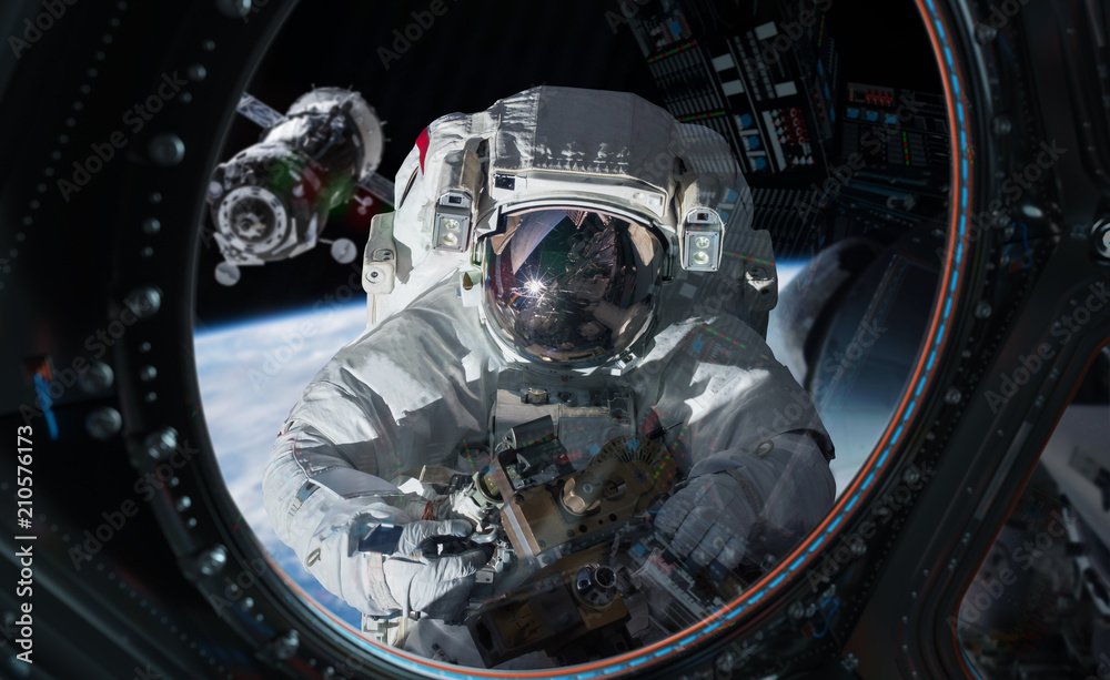 Fototapeta premium Astronaut working on a space station 3D rendering elements of this image furnished by NASA
