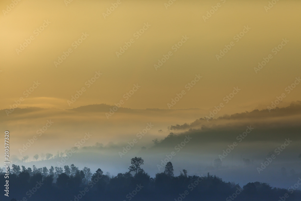 Sunrise on top of mountain with foggy and clear sky Sunrise on top of mountain with foggy and clear sky