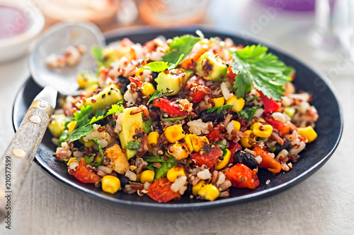 Black beans, avocado, corn, tomato, rice & quinoa salad with chilli dressing  photo