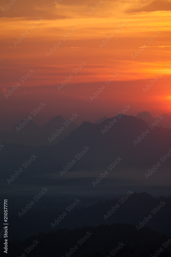 Colorful sky of sunrise above mountain on cloudy at winter season