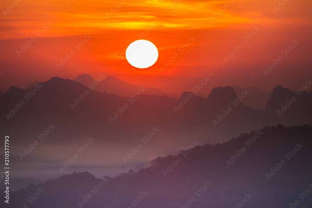 Colorful sky of sunrise above mountain on cloudy at winter season