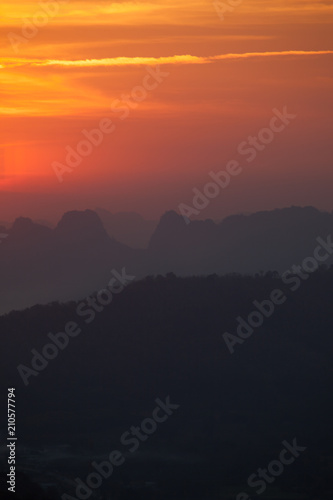 Colorful sky of sunrise above mountain on cloudy at winter season