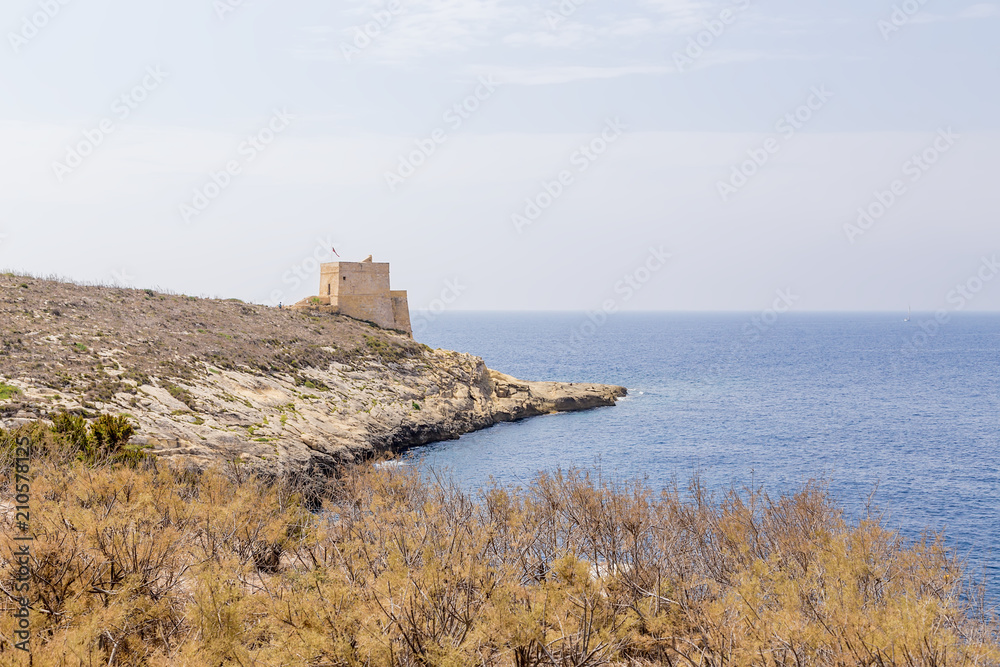 The island of Gozo, Malta. The Xlendi Tower (1650) at the entrance to the eponymous bay