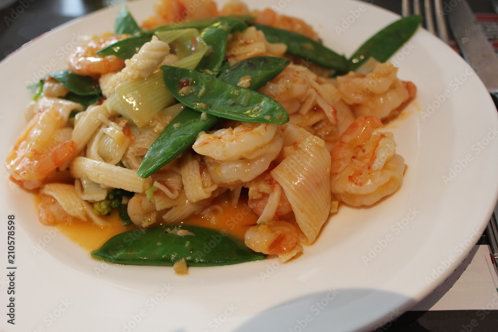 a plate with fried shrimps and vegetables for dinner a plate with fried shrimps and vegetables for dinner