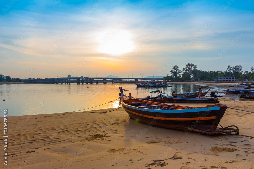 scenery sunrise above Sarasin bridge. fishing boats parking on the Sarasin beach. Sarasin bridge linking the province of Phang Nga and Phuket.