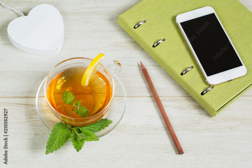 Refreshment working day concept: Cup of herbal linden tea on white background. Flat lay Refreshment working day concept: Cup of herbal linden tea on white background. Flat lay