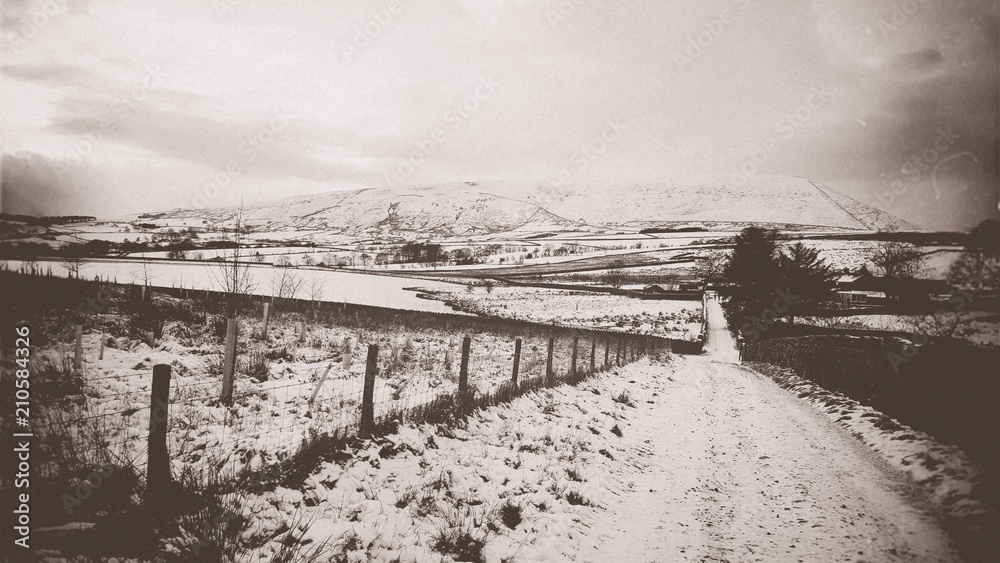 Pendle hill, lancashire - England. The hill is famous for its links to three events which took place in the 17th century: The Pendle witch trials (1612). Aged looking picture.