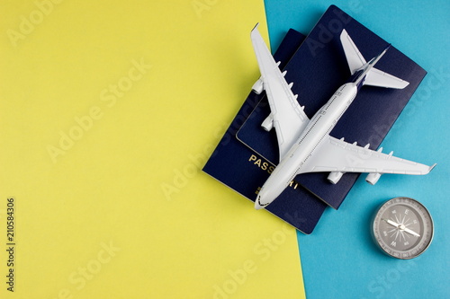 Plane, aircraft on color background and passport. Travel concept. Empty space for text and design