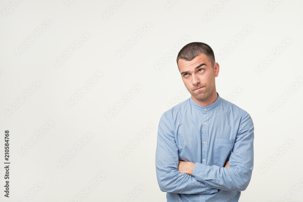 Let me think or oubt concept. Young hispanic man is very serious and pensive Let me think or oubt concept. Young hispanic man is very serious and pensive