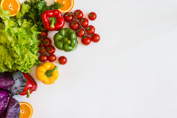 Fresh colorful organic vegetables on a white background, farming and healthy food concept. Copy space. Flat lay