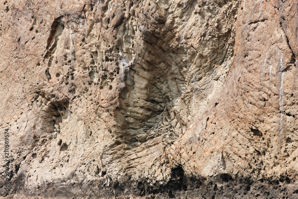 Naklejka premium Rock texture. The texture of the rock rock located in the Kara-Dag natural reserve. Rocks of the Karadag.