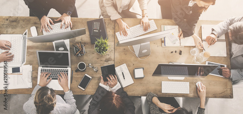 People working around a table photo