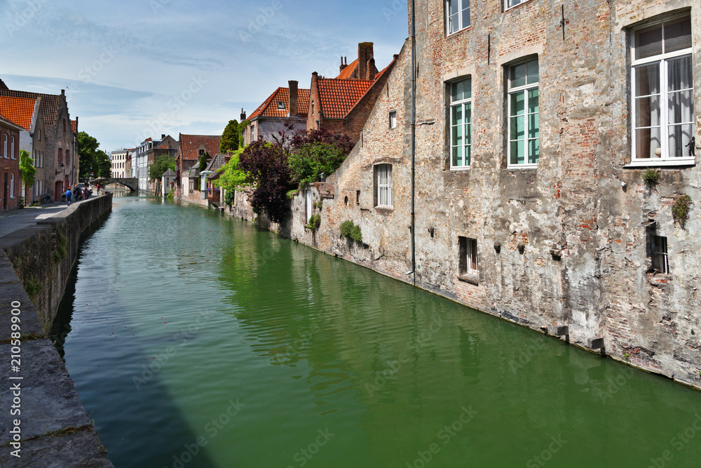 Ancient houses on the bank of the channel in Bruges, Belgium. Ancient houses on the bank of the channel in Bruges, Belgium.