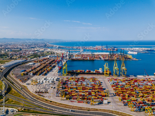Aerial view of the commercial port of Valencia. Container terminal and ship during loading.